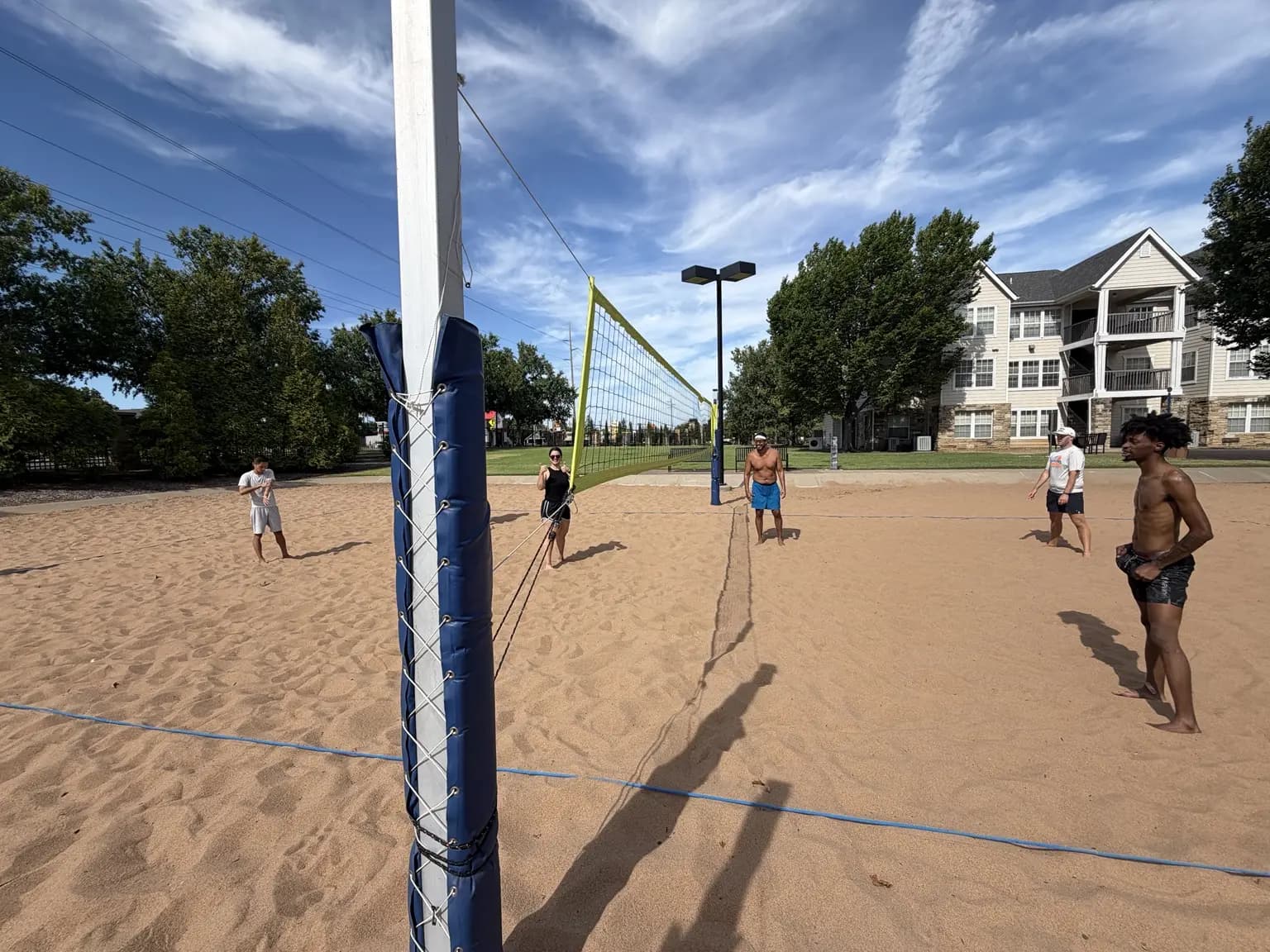 Players read a high ball from a post-side view of the August 15 pickup