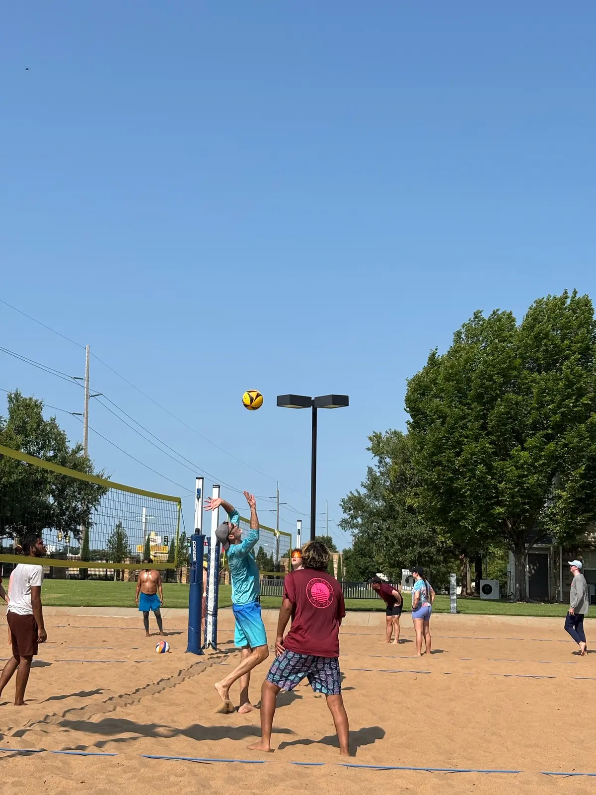 Sandline players read a high ball during a Saturday pickup game