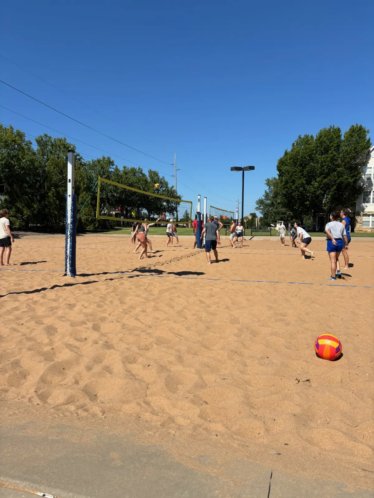 Players and friends gathered courtside during a busy Sandline Saturday