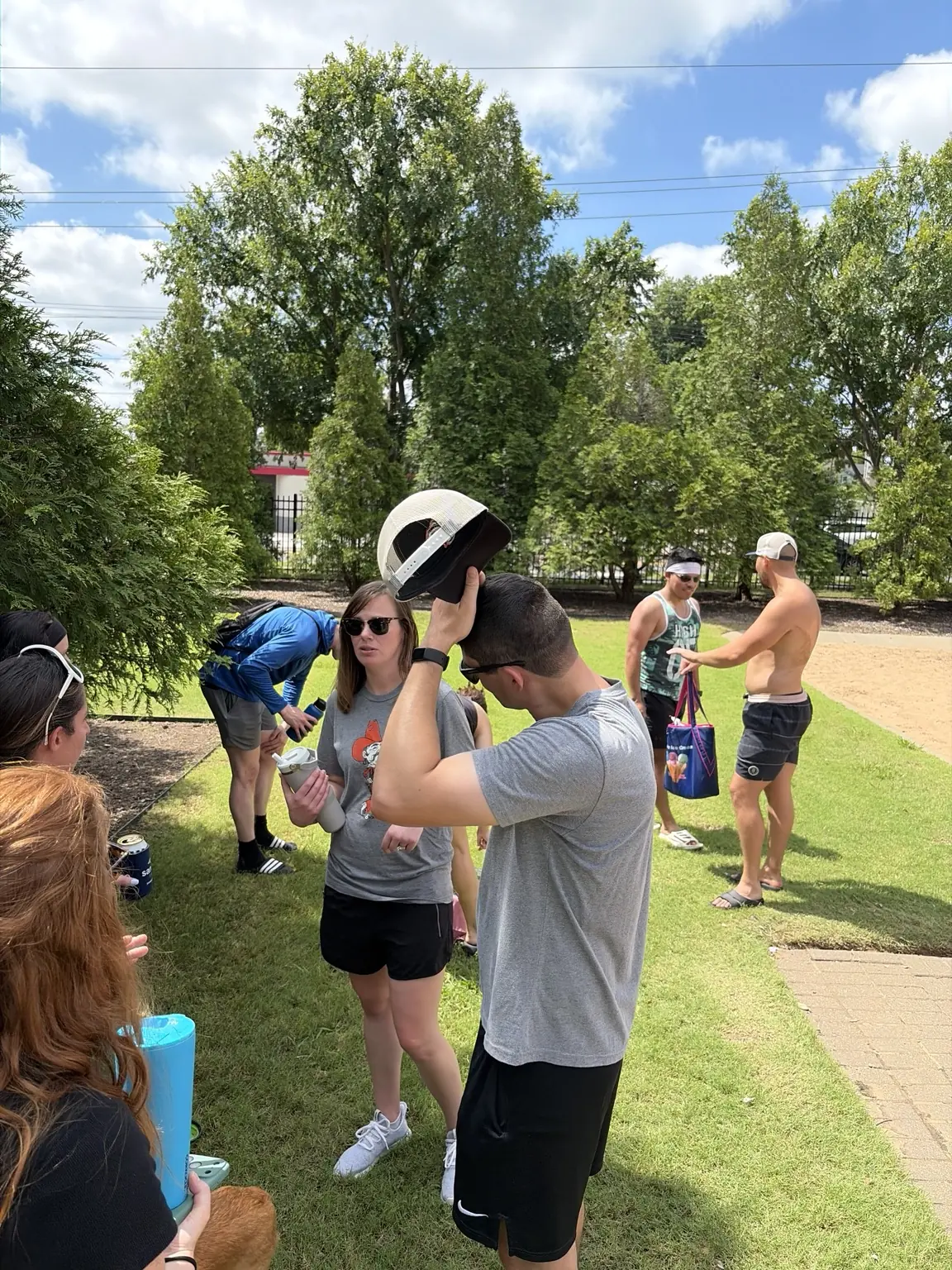Sandline players talking and cooling down beside the courts